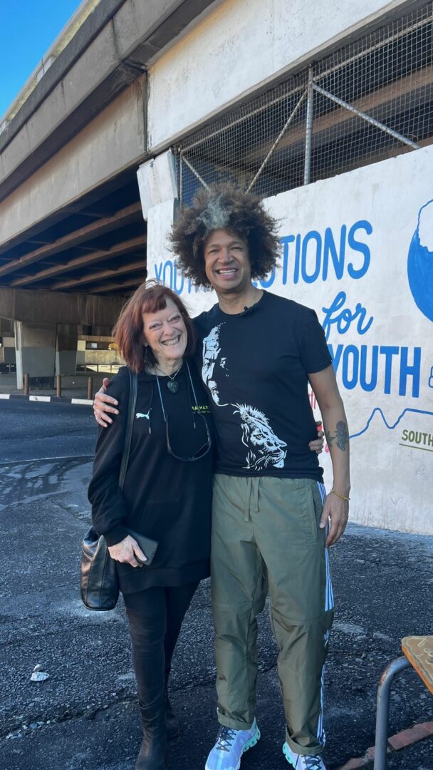 Marc Lottering with Margolite Williams of SA Harvest, packing buckets at Youth Solutions in Cape Town