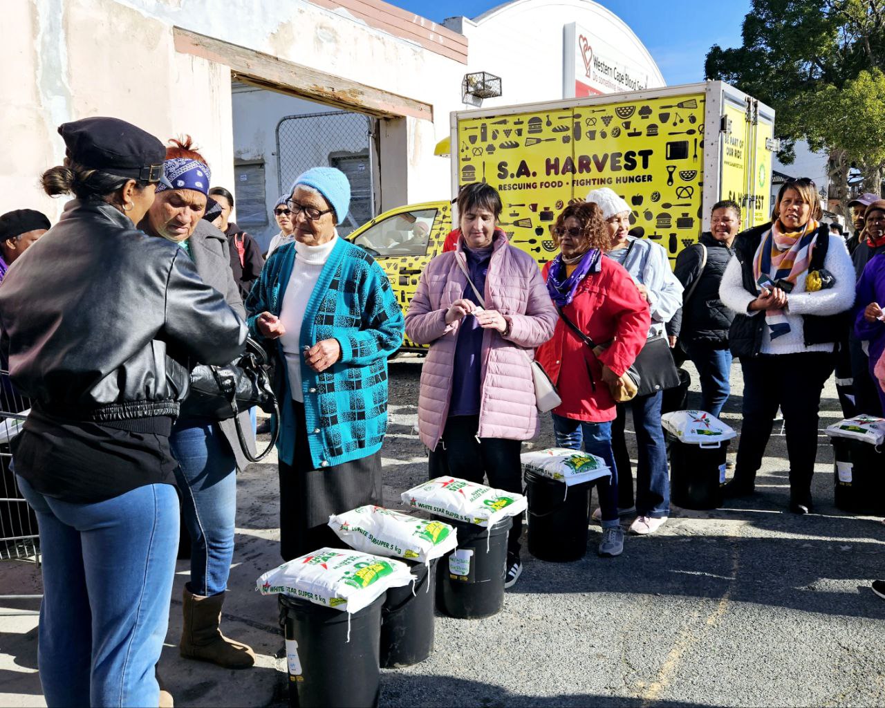 Distributing buckets of nutrition after Mandela Day in 2024