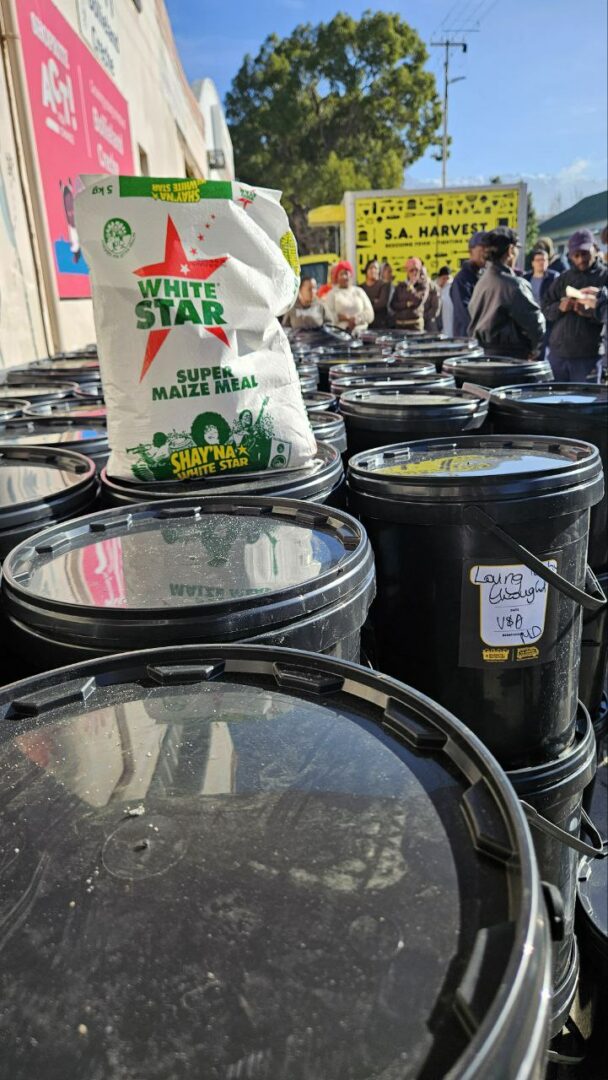 Distributing buckets of nutrition after Mandela Day in 2024