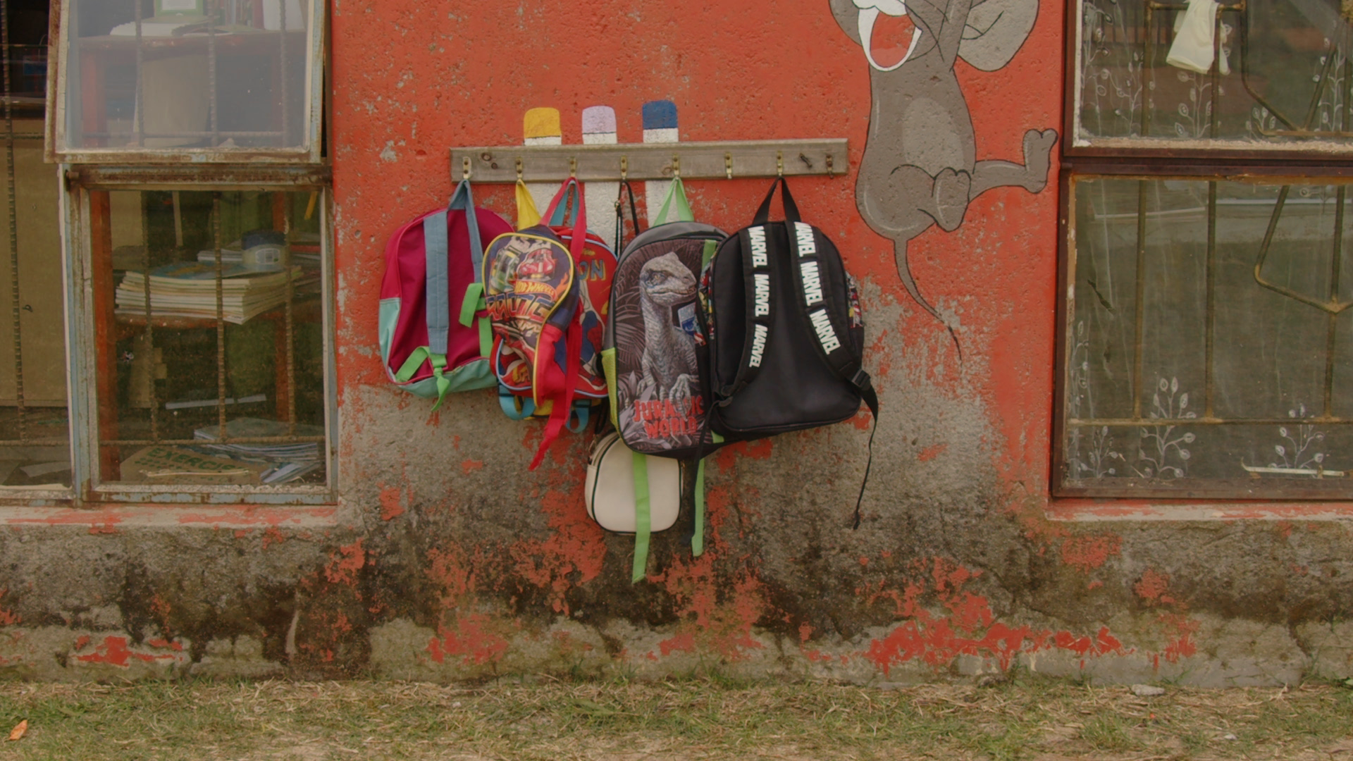 Children’s school bags neatly hung outside the classroom at Nonhle Day Care Preschool.