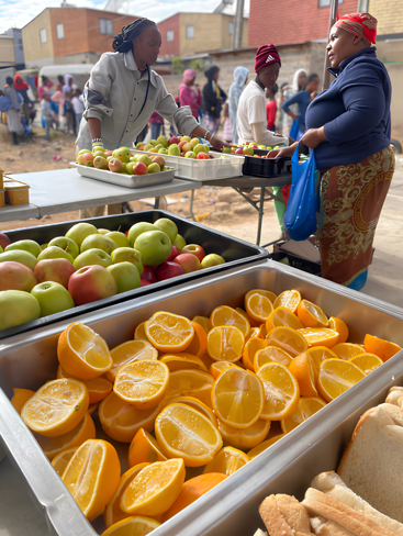 Surplus citrus rescued from farms and packhouses is redirected by SA Harvest to community kitchens in Alexandra, turning potential waste into nourishment and dignity.
